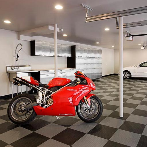 Garage deck flooring with a red motorcycle parked on it