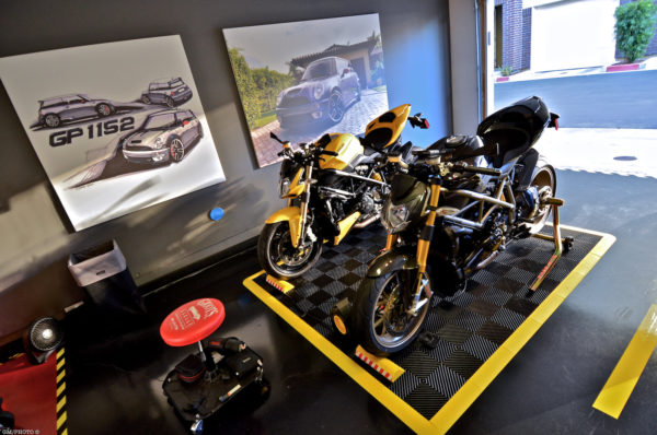 two motorcycles racedeck parking pad