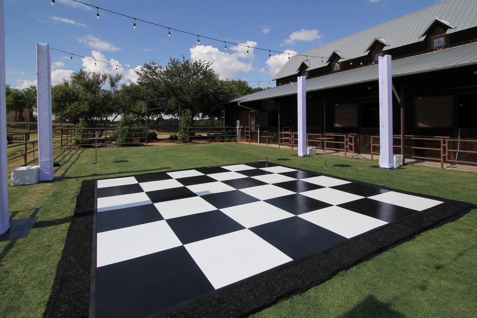 Slate black and white plus dance floor at a farm event venue