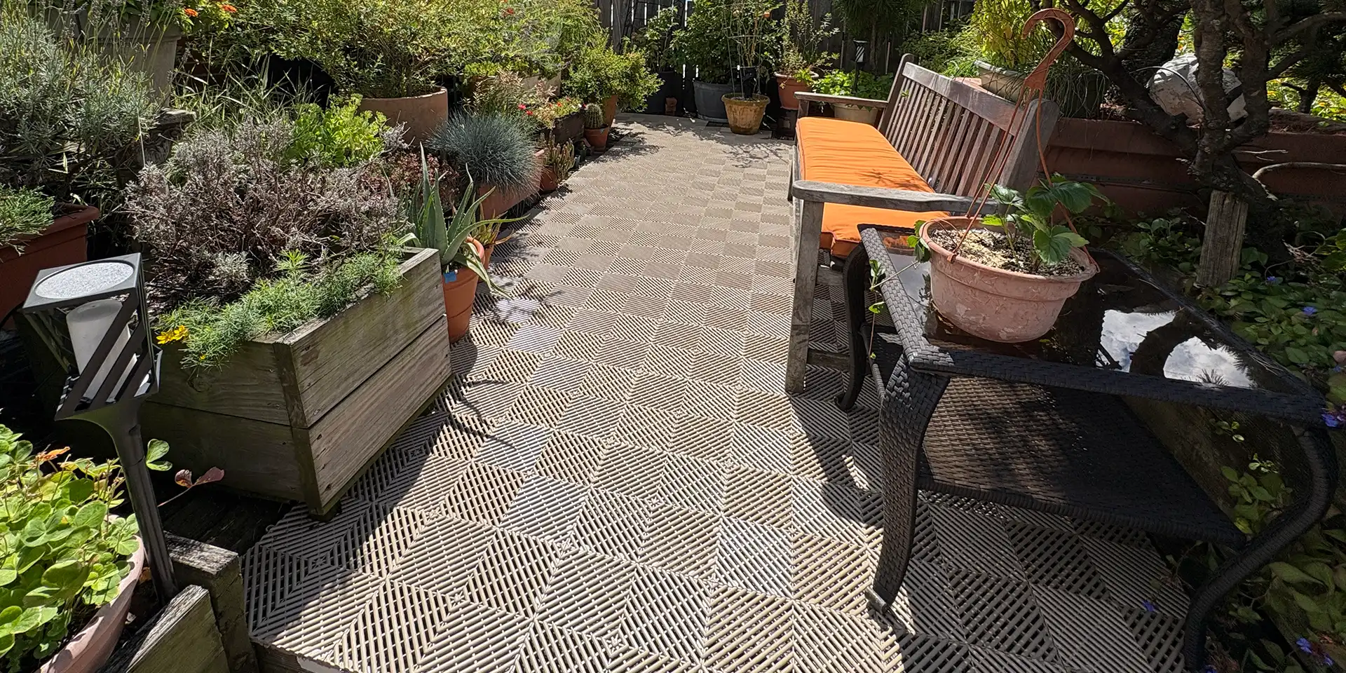 A patio garden with Free-Flow deck tile