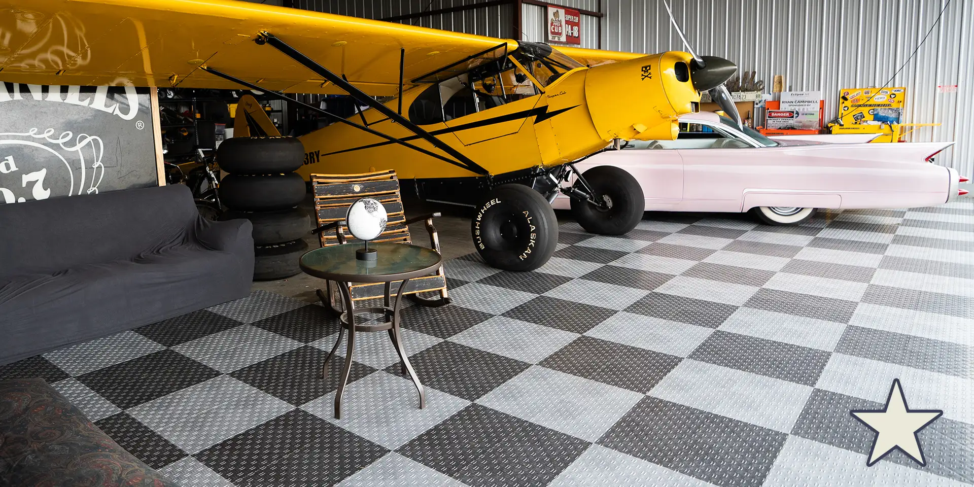 Yellow STOL plane and pink Cadillac on GarageTrac